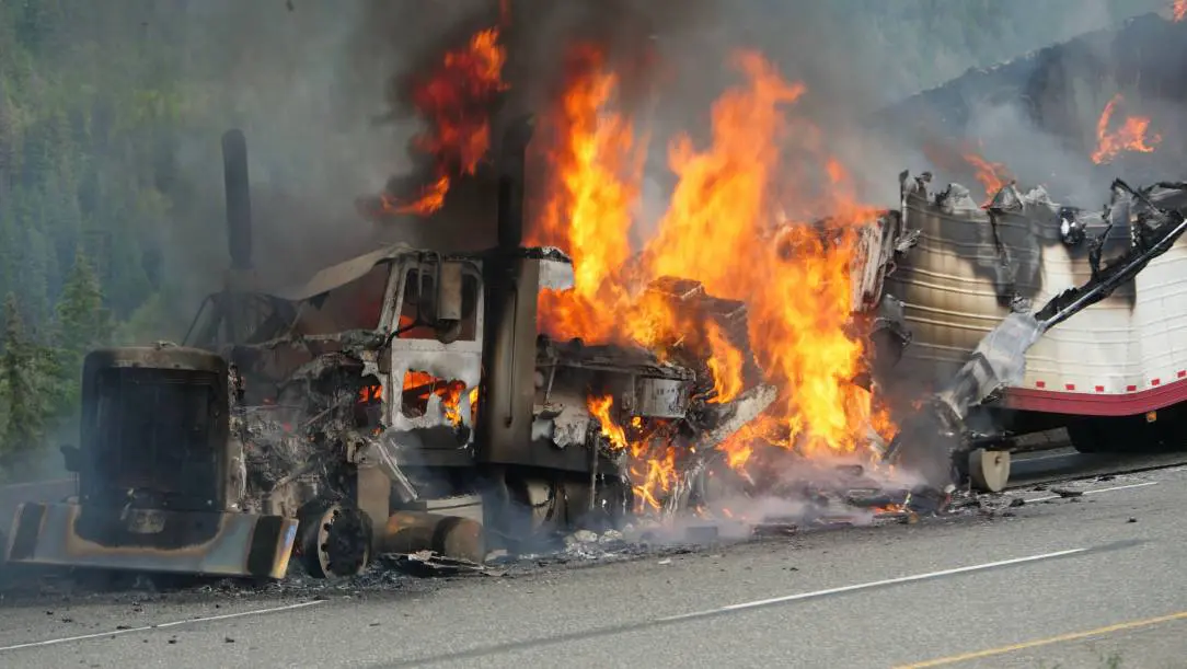 A fire truck that is on the side of the road.