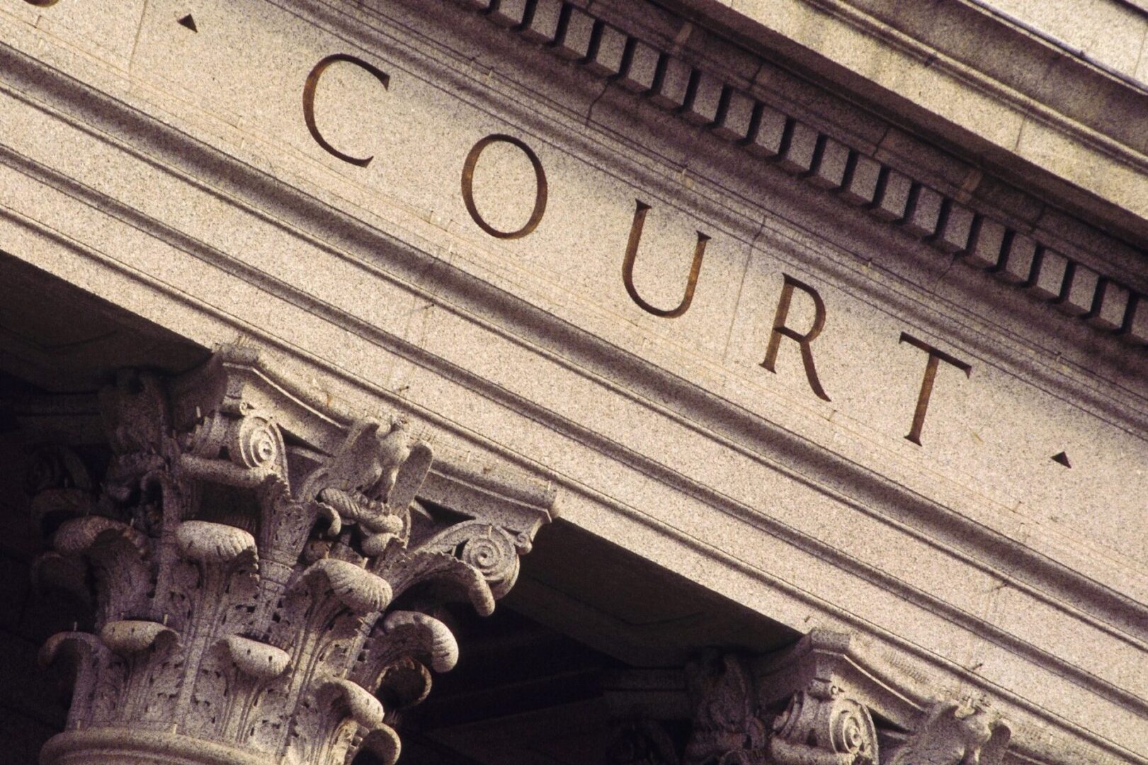 A close up of the word court on top of a building