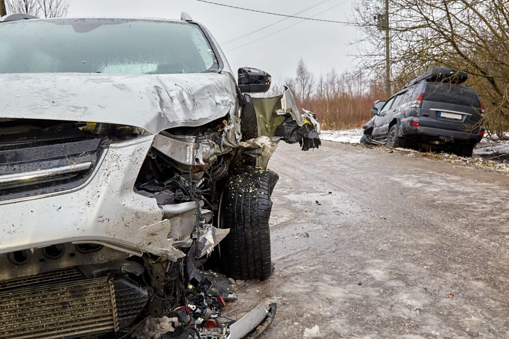 A car that has been wrecked in the snow.